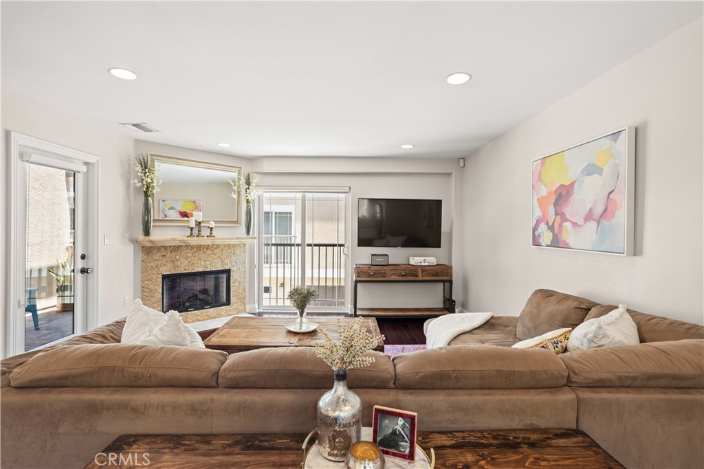Fall in LOVE with Toluca Lake Living! Welcome to this charming 3 bedroom, 3.5 bathroom townhome, located in the highly desirable Toluca Lake. This beautiful 1,550 sq ft home offers a spacious floor plan with hardwood flooring throughout and an abundance of natural light, and no one above or below.

Step inside to the first floor where you'll find direct access to the 2-car garage and a convenient bedroom with an en suite bathroom, perfect for a personal gym or office space.

Ascend the stairs to discover a host of upscale features. The modern kitchen is equipped with stainless steel appliances, contemporary cabinetry, a stylish backsplash, and sleek finishes. Adjacent to the kitchen, the living area boasts a charming fireplace, creating a cozy atmosphere perfect for both relaxing and entertaining guests. The dining room offers direct access to a charming patio, ideal for soaking up the California sun or enjoying your morning coffee.

On the third level, you'll find the primary bedroom with a large walk-in closet and an en suite bathroom featuring a dual sink vanity, a soaking tub, and a walk-in shower, providing both luxury and convenience. Another well-appointed bedroom with its own bathroom completes this floor, providing ample space for family or guests.

Living in Toluca Lake offers an unparalleled lifestyle. Just minutes away, you'll find Toluca Lake Village, where you can enjoy a variety of fine dining options, boutique shops, and vibrant entertainment venues. With its tree-lined streets, charming atmosphere, and close-knit community, Toluca Lake is the perfect blend of small-town charm and urban convenience. Don't miss out on this incredible opportunity to make this beautiful Toluca Lake townhome your own!