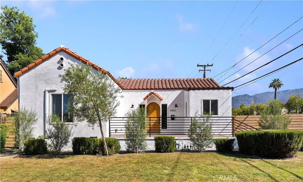 Welcome to this beautifully remodeled Spanish-style home in desirable Altadena! As you step through the arched custom wood front door you'll discover a bright, airy, open-concept layout, complete with oversized windows and arched doorways. This property is full of character, featuring stylish built-in shelves and cabinetry. The dining room opens to an updated kitchen that offers plenty of cabinetry and counter space, along with newer appliances, including a range, dishwasher, refrigerator and a farmhouse apron sink. There’s also a nook that’s perfect for your coffee or beverage station. The charm and design of the home are complemented by quality materials throughout. The master suite boasts a remodeled bathroom, a spacious closet, and double French doors that open to a wooden deck leading to the backyard. Additional features include energy-efficient ductless split units for comfortable heating and cooling, as well as a generous backyard space. The property is just minutes away from the historic Rose Bowl, Brookside Golf Course, Rose Bowl Aquatics Center, Kidspace Museum, Old Town Pasadena, JPL, Cal Tech, the Pasadena Gold Line, and Paseo Colorado.