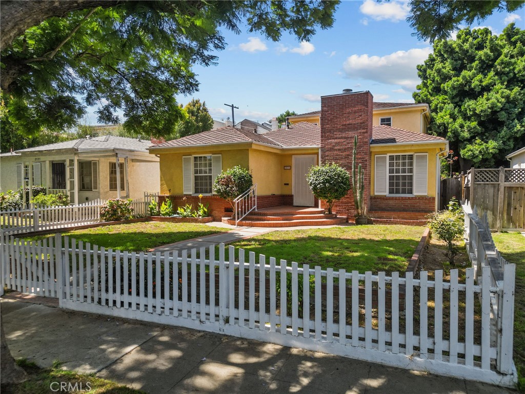 Welcome to this extremely well maintained property on desirable Wellesley Avenue! Experience the serenity, convenience, and endless possibilities that this 3 bedroom, 2 and a half bath home has to offer. Situated on a spacious lot in a coveted pocket of West Los Angeles, this property provides the perfect blend of privacy and tranquility. There are 2 lovely bedrooms,1.5 bathrooms on the lower level and the upstairs consists of a huge master bedroom/bathroom suite. The spacious kitchen offers stainless appliances, granite and tile counters and opens to a huge inviting great room accented by wood shutters and a beautiful fireplace. There is a formal living room with fireplace and a separate laundry room off the hallway. The roomy backyard offers a detached two car garage, mature trees and lovely patio where you can unwind and soak up the California sunshine. Enjoy easy access to a plethora of restaurants, coffee shops, numerous parks and shopping destinations. With the beach just a bike ride away, you can savor the coastal lifestyle and soak up the sun at your leisure.