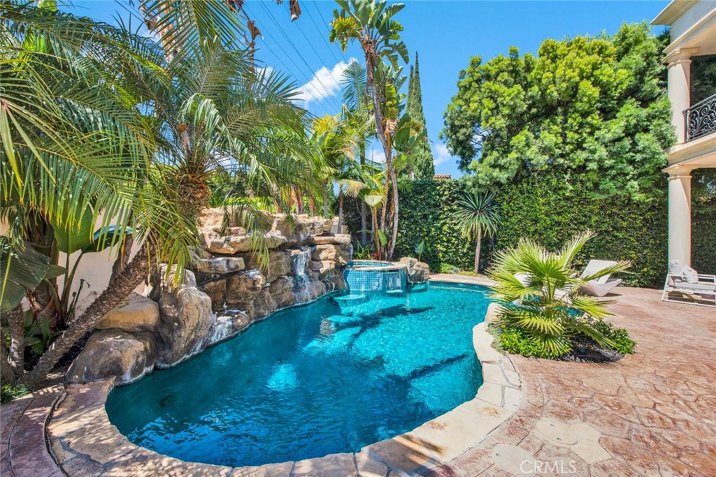 This stunning Mediterranean 5-bedroom, 5.5-bathroom dream home located in one of the most desirable and sought-after North of Wilshire Beverly Hills neighborhood. As you step inside, you'll be greeted by the grandeur of marble flooring and a breathtaking staircase. The high ceilings and recessed lighting throughout the home create an inviting and spacious ambiance. The gourmet kitchen is a chef's dream, featuring Viking appliances, granite countertops, and an open floor plan perfect for entertaining guests. The primary suite offers an en suite bathroom and ample closet spaces and each additional bedroom is generously sized with an en suite bathroom. Step outside to your own private oasis, complete with a tropical heated pool and jacuzzi. The gated front gate and rear entrance provide both privacy and security. This home is ideally situated, allowing you to enjoy all the luxuries of living in Beverly Hills. You'll have easy access to the finest shops and restaurants, making it a true paradise for those who appreciate the finer things in life. Don't miss this opportunity to own a piece of Beverly Hills and experience the epitome of luxury living in this prestigious neighborhood.