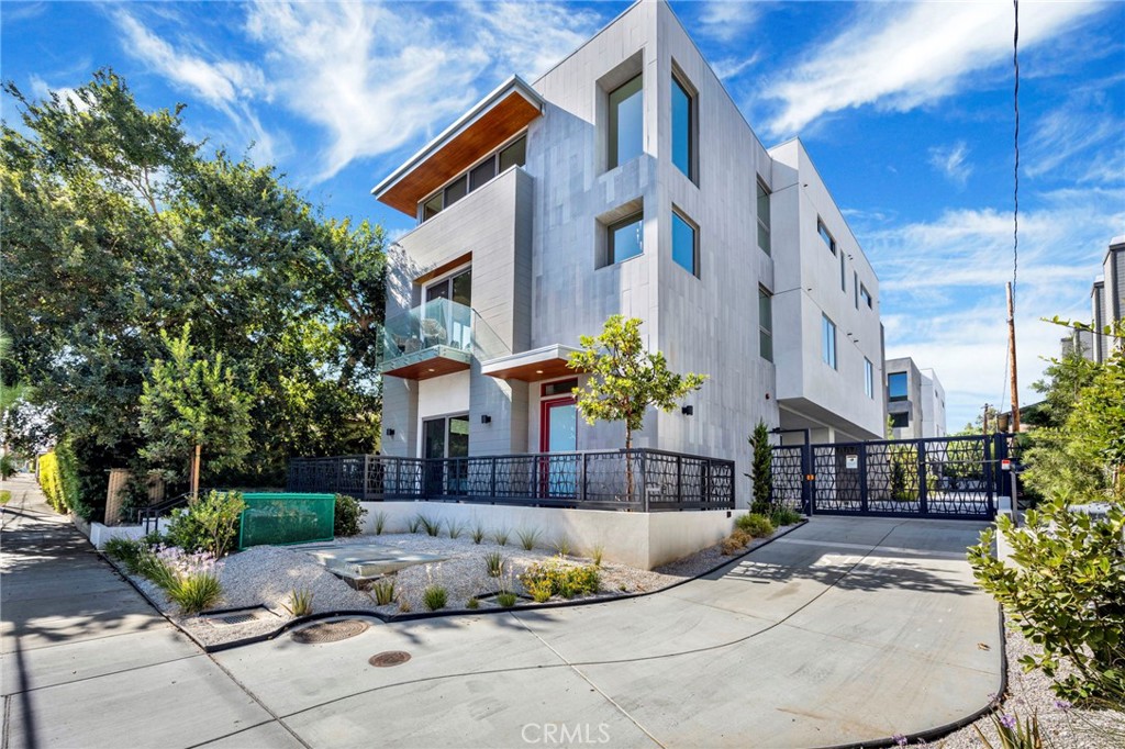Experience the comfortable, easy-care living you crave in this newly constructed Pasadena townhome in the vibrant South Lake District! One of only four units in the project, the builder offers two different layouts to suit your unique lifestyle. Past the sun-kissed courtyard, enter through the glass-inlaid door and discover an awe-inspiring foyer welcoming you with crisp white tones, three-story ceilings, and gorgeous wide-plank flooring.
Take the staircase to the second level where you’ll find the open-concept living areas bathed in brilliant natural light, creating a lively atmosphere for entertaining. Large windows frame delightful neighborhood views, while a designer chandelier lends elegance to the dining nook. Flaunt your culinary finesse in the chef-inspired kitchen, sporting top-of-the-line stainless steel appliances, custom cabinetry, subway tile backsplash, and two-toned quartz countertops extending to the pendant-lit waterfall island. Glass sliders open to scenic balconies with frameless glass railings - ideal spots to share nightcaps at the end of the day. Distributed across multiple floors, three stunning and well-sized private retreats provide a serene escape, including a ground-level ensuite room with yard access and a full bath that’s fabulous for overnight company. Outshining them all, the top-floor primary suite is an oasis all its own, pampering you with an exclusive den, an overlooking balcony, a generous walk-in closet, and a luxurious open ensuite with an oversized shower and a spa-like soaking tub. Additionally, there’s an attached 2-car garage. With Polytechnic School, CalTech, boutique shops, fine dining, and parks close by, and cultural destinations like The Langham and Norton Simon Museum just minutes away, why wait? Come for a tour before this gem’s gone for good!
