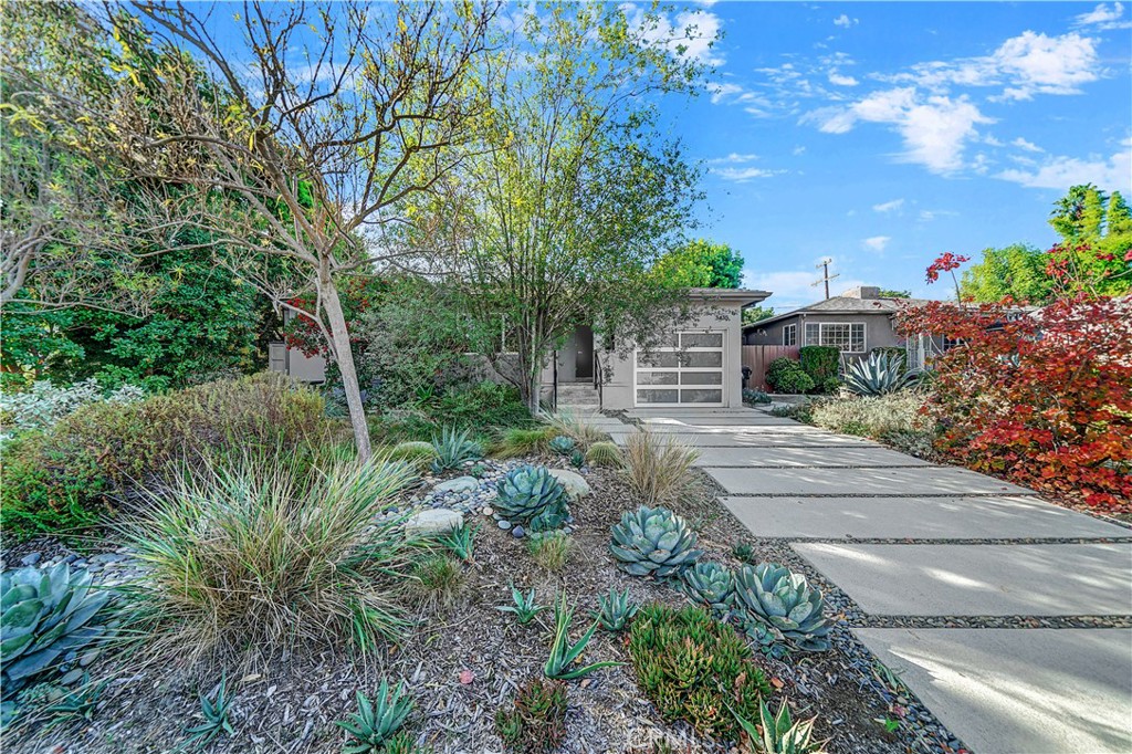 A peaceful retreat in the heart of Westside Village, this home has all the qualities of a garden oasis combined with the best city conveniences. The home features a spacious open floor plan, high ceilings and centrally located kitchen, with built-in speakers and wood flooring throughout. You’ll enjoy entertaining both within the home and out in the garden with generous patio spaces. Enjoy the privacy and head out the back doors for morning coffee, shaded by mature trees. The primary suite is located off the back garden, with access through its own French doors. Custom cabinetry offer plenty of closet storage with warm birch doors and a bright but private window. Wash away the day in the elegantly remodeled primary bath in the walk-in shower, or relax in the heated soaking tub. Built-in lighted Robern medicine cabinets fit seamlessly into the soothing spa-like environment complete with heated flooring. The beautiful front and back garden has been twice featured on the Theodore Payne Native Plant Garden Tour and is a registered Surfrider Ocean Friendly Garden. Drought friendly, it features low-maintenance, mixed California native and Mediterranean plants that attract abundant wildlife, on-site water natural capture, and permeable driveway. A rain garden and butterfly garden provide year-round interest and views out every window enclosed in beautiful red cedar fencing. Head west and in just a few minutes you are at world-famous Venice Beach or with easy access to the freeways you can reach Downtown Los Angeles, the Getty Center, the Santa Monica Mountains and all of greater Los Angeles.