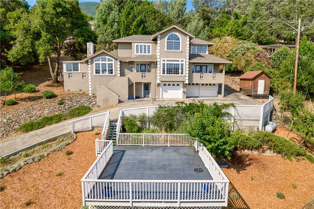 Welcome to your dream home nestled in one of the most exclusive neighborhoods, perched on a serene hilltop at the end of a tranquil cul-de-sac. This extraordinary property boasts breathtaking lake views and offers a life of luxury, privacy, and unparalleled elegance. As you step through the grand entrance, you'll be immediately captivated by the soaring high ceilings and the exquisite detail that graces every corner of this stunning residence. With 3 spacious bedrooms and 3 pristine bathrooms. This home is designed for comfort and style. The heart of the home, the kitchen, is a chefs delight. Recently updated with high-end fixtures and state-of-the-art appliances, it offers ample space for culinary creations. The adjacent bar area is perfect for entertaining guests and enjoying leisurely evenings. Discover the charm of the secret room concealed behind a bookshelf, a perfect hideaway for quiet reflection or an intimate gathering. The bonus room features its own bathroom and kitchenette, offering endless possibilities as a guest suite or home office. Every inch of this abode bespeaks elegance. High-end finishes and updates seamlessly blend with timeless design, ensuring that this home is not only gorgeous but functional. The oversized 3-car garage provides plenty of space for vehicles and storage, catering to all your needs. The large property surrounding the home offers ample space for outdoor activities and creative landscaping. Community features include private beach, club house, golf course and marina. Don't miss the opportunity to own this masterpiece of modern living.