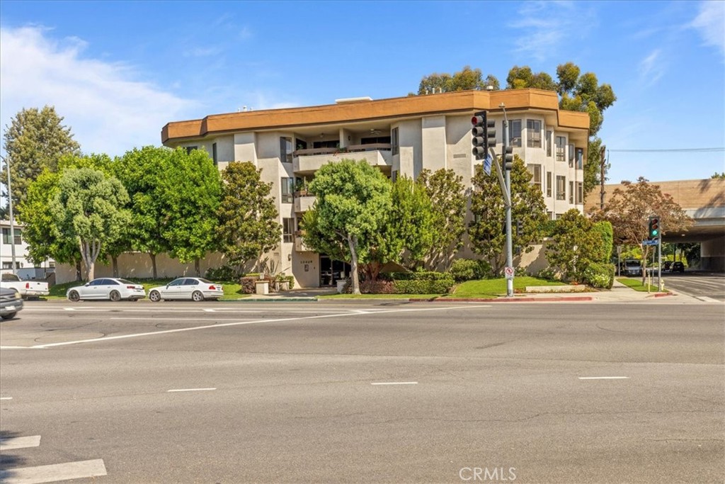 Beautiful one level executive condo in the heart of Toluca Lake. In close proximity to the village, shops, market and many restaurants. This end unit is a rare find for its size, located front facing on the second floor. Upon entering this 3 Bedroom, 3 bath unit you will feel the warmth of rich hardwood floors. There is a mantled fireplace, cozy wet bar and large dining area. The cook of the home will love the kitchen with updated cabinets, marble counter tops and stainless steel appliances. The large balcony is perfect for coffee or a good read. One of the guest bedrooms doubles as an office or family room with its own updated bath. Down a central hallway is a guest suite with its own updated bath and has large closets and balcony access. The master retreat is oversized with large closets, and balcony access. There is a large bathroom with double sinks, and soak tub. The complex is wonderfully maintained with meeting room, pool and has earthquake insurance. This unit has two side by side parking spots and lots of storage. Other amenities include; Updated windows, updated HVAC, newer flooring and kitchen and recessed lighting.