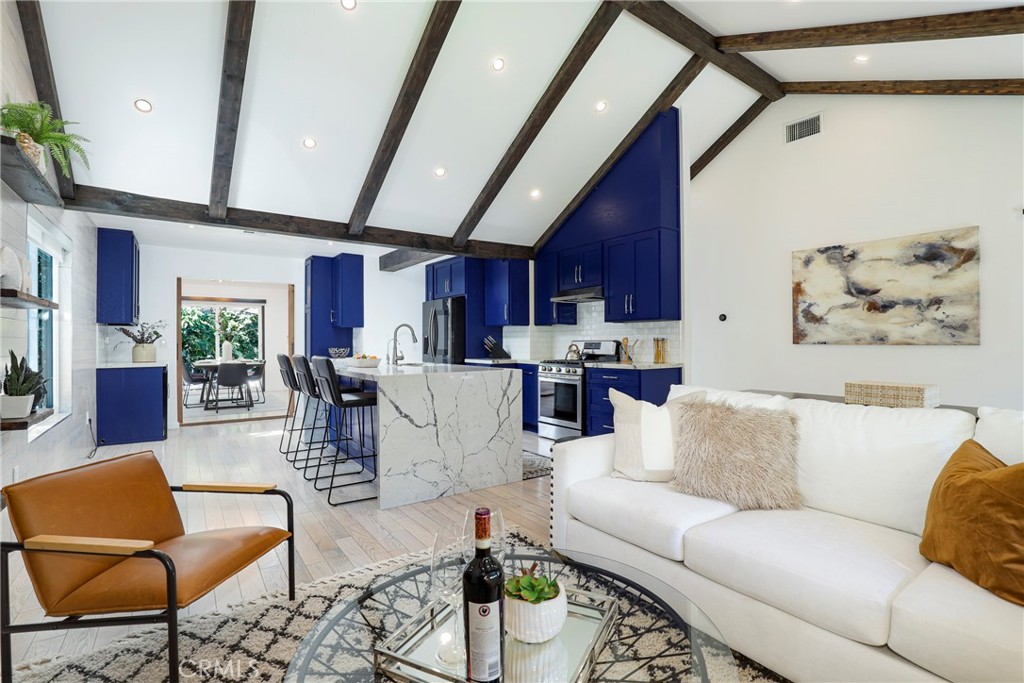 Seller motivated!Discover your private oasis in the heart of Burbank at 1107 N Rose St. This beautifully renovated 4-bedroom, 2-bathroom home spans approximately 1,800 sqft, with potential ADU sqft, on a generous 6,746 sqft lot. Meticulously updated 4 years ago, this residence blends luxury, functionality, and privacy. Venture inside to find a newly renovated interior featuring high-end hardwood flooring, accented walls, and vaulted ceilings complete with an electric fireplace and elegant wooden beams. The kitchen is a culinary delight with quartz waterfall countertops, an island with ample storage, a coffee station, and a separate drinks bar. Enjoy the convenience of soft-close and touch-open kitchen cabinets. Updated plumbing, electrical systems, and a roof ensure peace of mind, along with a full water filtration system and alkaline drinking water faucet. The home is climate-controlled with a top-tier HVAC system managed by Nest. The primary suite offers a spacious retreat with an en-suite bathroom featuring a walk-in rain shower and dual sinks. A second bathroom includes a jacuzzi tub and shower. Motorized drapes enhance privacy and elegance throughout the home. Outside, the beautifully landscaped backyard is an entertainer’s dream, complete with a deck, new turf, and mature fruit trees including avocado, mandarin, pomegranate, grapefruit, and passion fruit, all on automated irrigation. Additional highlights include a Ring doorbell and an alarm system for security. Parking is plentiful with space for 3-4 cars in the driveway and a one-car garage with ADU potential. The garage, equipped with full water and electric connections, houses a separate washer and dryer. It’s permitted/approved by the city for an ADU, with plans available from the architect with a full-price offer if the buyer wishes to pursue this option. Located in a serene neighborhood near the Chandler bike path, this residence offers tranquility and convenience. Experience the best of Burbank living with easy access to amenities and a strong sense of community. Embrace the opportunity to call this exceptional property your new home. Contact us today to schedule a private tour.