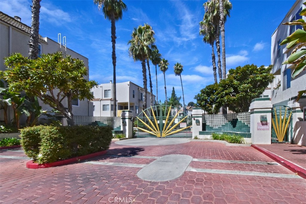 Turnkey, multi level townhouse located in the sought after Sherman Oaks exclusive gated community of Chandler Park Village, a desirable corner 3-bedroom, 2.5-bathroom. Enter the foyer to a large living room with wood flooring, cozy, decorative, fireplace and high ceilings creating a light airy atmosphere. A large door opens to the Zen patio with water fall and surrounded by tall bamboo plants adding to privacy. At his level you have access to the updated powder room, and stairs to the private 2 car garage with laundry area. 
Up mid level you enter the updated kitchen with large chef-style sink, quartz countertops and stainless steel appliances, adjacent is the breakfast nook and the dining room with access to outdoor balcony. Upstairs is flooded with light from the large skylight, you'll find the three generously-sized bedrooms with ample closet space. Main ensuite with vaulted ceilings and large windows and its attached bathroom featuring a spacious soaking tub, new flooring. The other two spacious bedrooms share the updated bathroom with walk in shower. The living quarters' windows have wood framed privacy screens (removable), the sleeping quarters' windows are fitted with mini blinds. Freshly painted throughout, all bedrooms and stairs to bedrooms have new laminate flooring, is ready for the new owner. Unit is wired with a Nest thermostat.
This beautiful community offers amenities such as two pool areas, three spas, a newly renovated gym, BBQ area, visitor parking and a recreation room  for endless opportunities to relax and entertain.