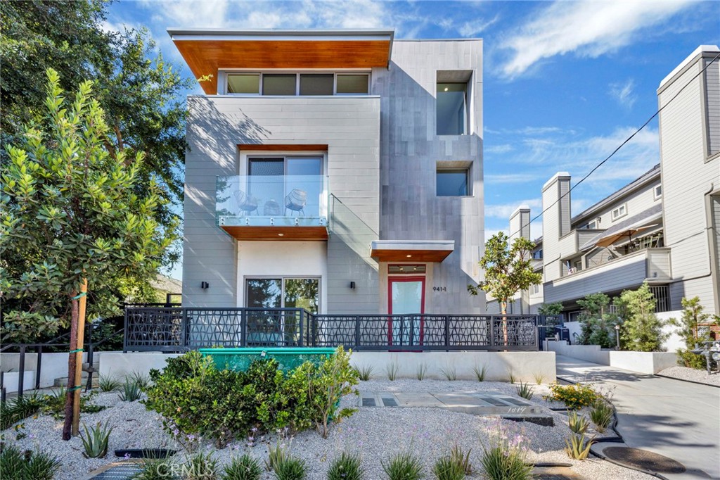 Experience the comfortable, easy-care living you crave in this newly constructed Pasadena townhome in the vibrant South Lake District! One of only four units in the project, the builder offers two different layouts to suit your unique lifestyle. Past the sun-kissed courtyard, enter through the glass-inlaid door and discover an awe-inspiring foyer welcoming you with crisp white tones, three-story ceilings, and gorgeous wide-plank flooring.
Take the staircase to the second level where you’ll find the open-concept living areas bathed in brilliant natural light, creating a lively atmosphere for entertaining. Large windows frame delightful neighborhood views, while a designer chandelier lends elegance to the dining nook. Flaunt your culinary finesse in the chef-inspired kitchen, sporting top-of-the-line stainless steel appliances, custom cabinetry, subway tile backsplash, and two-toned quartz countertops extending to the pendant-lit waterfall island. Glass sliders open to scenic balconies with frameless glass railings - ideal spots to share nightcaps at the end of the day.Distributed across multiple floors, three stunning and well-sized private retreats provide a serene escape, including a ground-level ensuite room with yard access and a full bath that’s fabulous for overnight company. Outshining them all, the top-floor primary suite is an oasis all its own, pampering you with an exclusive den, an overlooking balcony, a generous walk-in closet, and a luxurious open ensuite with an oversized shower and a spa-like soaking tub. Additionally, there’s an attached 2-car garage. With Polytechnic School, CalTech, boutique shops, fine dining, and parks close by, and cultural destinations like The Langham and Norton Simon Museum just minutes away, why wait? Come for a tour before this gem’s gone for good!