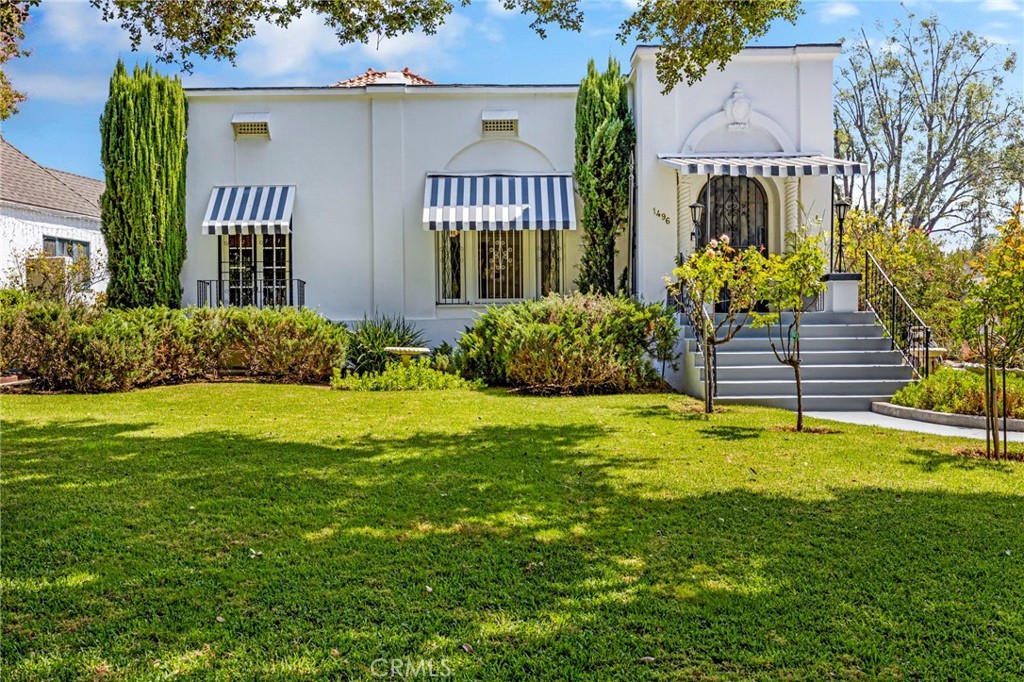 Discover timeless elegance in this charming 4 bedroom, 2.5 bath home nestled in the highly sought-after Historic Highlands neighborhood. This stunning residence, lovingly maintained for six decades, offers a rare opportunity to own a piece of history in one of the area's most desirable locations. Step inside and be greeted by a grand family room boasting the original wood floors that showcase the craftsmanship of a bygone era. The family room also features a high ceiling adorned with an exquisite chandelier and intricate crown molding. Cozy up by the fireplace in the family room or enjoy the warmth of a second fireplace located in the versatile ground floor bedroom, which can easily serve as a guest room or home office. Cook dinner in your spacious kitchen, and then savor your meal in the dining room, an intimate space perfect for family gatherings or entertaining guests. The home's thoughtful layout includes a laundry room, making everyday chores a breeze. Storage is plentiful with a spacious basement, perfect for storing seasonal items or creating a hobby space. The long driveway leads to a 2-car garage, providing ample parking. The backyard is a private oasis, featuring fruit trees and a charming workplace behind the garage, ideal for gardening, woodworking, or pursing creative endeavors. Located in a quiet, residential neighborhood, this home offers a peaceful retreat while still being conveniently close to local amenities. Don't miss your chance to own a piece of history in the heart of the Historic Highlands. Schedule a private tour and experience the timeless charm of this unique property!