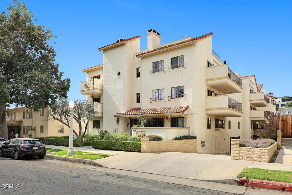 Situated in the highly sought-after Pasadena Playhouse District, this single-level corner unit boasts the largest patio in a boutique complex of just 17 units. With its south-facing exposure and expansive private patio, the home is filled with natural light and an inviting, airy ambiance. It's truly in move-in condition! The unit showcases stunning features, including beautiful hardwood floors, high ceilings, a travertine fireplace, custom built-in cabinetry, and recessed lighting. The spacious kitchen is a chef's dream, featuring granite countertops, stainless steel appliances, and a versatile mobile island. Both bathrooms have been tastefully remodeled with elegant fixtures and finishes. The master suite includes a large walk-in closet, thoughtfully customized for maximum storage. Inside the unit, you'll also find a convenient stackable washer and dryer. The well-maintained complex offers a range of amenities, including a pool, spa, sauna, gym, recreation room, elevator, and gated subterranean parking with two tandem spaces. This central urban location on a tree-lined street is just moments away from Old Town Pasadena, the South Lake Shopping District, the Gold Line, Caltech, and PCC.
