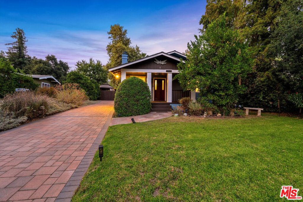 Welcome to this charming, 101 year old Craftsman home, ideally located near Christmas Tree Lane and minutes to Old Town Pasadena, JPL and Pasadena Community College. The property features an inviting covered front porch that has been recently updated and the entire house has all new exterior paint. The living room features a gas/wood burning fireplace with solid wood mantle. Original hardwood floors extend from the living room into a formal dining room perfect for large gatherings. The primary bedroom features an ensuite full bath and a separate walk-in closet. Two additional bedrooms feature Berber carpet and are enhanced by recessed lighting. French doors from the rear bedroom open to a lovely backyard, perfect for relaxation and outdoor entertaining. A solar tube brightens the 3/4 bath with natural light and the step-in shower includes safety hand bars. Dual-pane windows, tall ceilings and central air conditioning ensure comfort and convenience throughout this beautifully maintained Craftsman home. The spacious kitchen features dual sinks and ample options for those considering a cosmetic upgrade. The side yard includes raised garden beds for those who enjoy gardening, along with numerous fruit trees, including orange, grapefruit and avocado, as well as lavender, sage and butterfly plants. Recent updates include over $80k invested on a widened driveway with hand-laid pavers and a re-engineered drainage system, a landscaped border, a new sprinkler and drip irrigation system, and additional water lines in the backyard. The garage has a new roof, is fully insulated and features a 220-volt outlet (ready for an EV charging station), making it a potential ADU conversion project. Note: The owner is unaware of any permits for the mudroom and half bath- buyer to conduct their own investigation. Property is being sold as is. Inspection reports available upon request. Kitchen photos have been photoshopped to show cabinets if painted white with different wall colors.