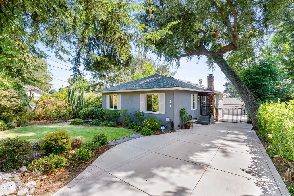 Sitting proudly on a verdant, private lot not far from the hiking trails of the Altadena foothills, Elegance and style abound in this sophisticated 3 bedroom/2 bathroom traditional home. The entrance leads you in to a gracious open floor plan from the living room, kitchen in to the dining room area.  This home was remodeled and expanded in 2017 with a thorough commitment to quality.  The kitchen is tastefully appointed with a Kucht Professional gas range, Frigidaire refrigerator, dishwasher, built in microwave, quartz countertops and island.  It is truly a chef's dream. A Life Source Water softener system, tankless water heater and Smart features are a few of the many amenities.  The primary bedroom contains its own en-suite bathroom and two walk-in closets. The primary bathroom is custom designed for a spa like experience. The shaded patio area below allows for outdoor entertaining year-round and the yard is professionally landscaped. Parking is easy with an electronic gate leading to a  2-car garage and long, wide, new concrete driveway with a built-in stairway off the patio area leading up to this single level home.   The location is ideal; near restaurants, grocery stores, parks, coffee shops, and a farmers market making this home a true gem of Altadena.