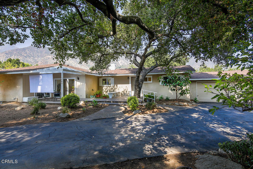 Welcome to 1780 N Altadena in beautiful Pasadena, CA. This 4-bedroom, 2.5-bathroom home is perched above Eaton Canyon Park and offers incredible mountain views. Upon entering you will notice a spacious living room with a fireplace that leads to the dining area and kitchen. Sliding doors lead out to the back patio, an ideal location to take in the views and natural beauty. Walking trails and sitting areas complete the natural landscaped backyard. A second front entry of the home opens to a second kitchen and family room, ideal for a future ADU. Other amenities include central heating and air, a detached garage, new paint and plenty of room for parking. With its prime location and stunning surroundings, 1780 N Altadena Dr is a true gem that offers tranquility, convenience, and possibilities.