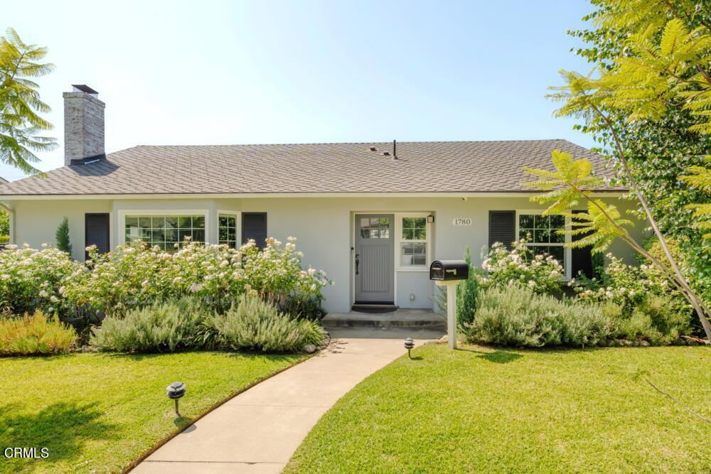 This pristine Traditional is nestled in a peaceful neighborhood between the Altadena Golf Course & the wondrous Eaton Canyon Nature Preserve. On approach, you quickly notice the newer dual pane windows, particularly the stunning mullioned bay window upon entering the living room. The space is invitingly open & bright with natural light, making the recessed lighting only an evening necessity. An eye-catching fireplace with a shiplap surround & stained wood mantle combine with the impressive wide plank wood flooring providing a more contemporary vibe which continues throughout the home. The kitchen is a generous size with plenty of room for both the dining table as well as a large center island & features shaker cabinetry, quartz countertops, saturated steel blue tile backsplash & stainless steel appliances including a trendy farmhouse style sink. The primary suite is simply striking with its dramatic vaulted ceiling, handsome barn doors, spacious walk-in closet & a luxurious bath with dual vanity & sensational shower tile! The shared bathroom is of a similarly modern style & while the other 2 bedrooms are well sized, one has lovely access to an enchanting pergola shaded patio.It should come as no surprise that this home underwent a huge transformation just 3 years ago, including not only major design renovations such as stylishly remodeling the kitchen & bathrooms, but also installing numerous integral systems of the home including a comprehensive smart home security system, Tesla power wall & paid off solar panels!