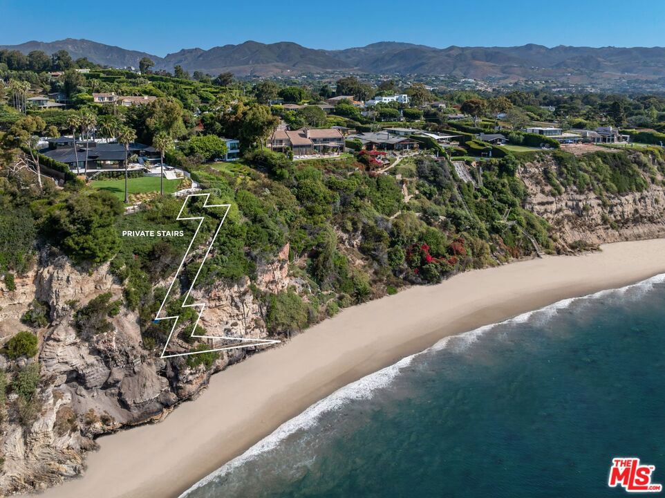 The crown jewel of Cliffside Drive, perched on the number one promontory view lot with private stairs for beach access at the 50-yard line of the two best surf point breaks in all of Malibu; Little Dume and Big Dume. Unobstructed explosive views of the majestic Dume bay, out to Catalina Island, Queen's Necklace, and downtown Los Angeles in the distance with its snowcapped mountains in back. This property has it all. This neighborhood is the most exclusive enclave in all of Malibu where the titans of the industry live and play for the best lifestyle Southern California has to offer. If you're a surfer or love to be connected to nature and all its sea life - whales, dolphins, and sea lions - in your backyard, it doesn't get better than this. Just completed and cladded in Japanese Shou Sugi Ban wood, walls of glass, French herringbone oak floors, Roman clay plaster walls, exquisite stones curated from around the globe, steel roof, guest house, oversized motor court, pool jacuzzi, oversized lawns, sports court, multiple fire pits, gym, spa with hot and cold plunge, two saunas, elevator, wine cellar, theater room, game room, outdoor kitchen, pizza oven, viewing decks, sliding doors for seamless indoor/outdoor living, and the latest and greatest amenities. This is a rare opportunity to own this Malibu sanctuary on the best street in the most exclusive neighborhood. Your hard work has led you to this moment, where you can finally experience the California dream.