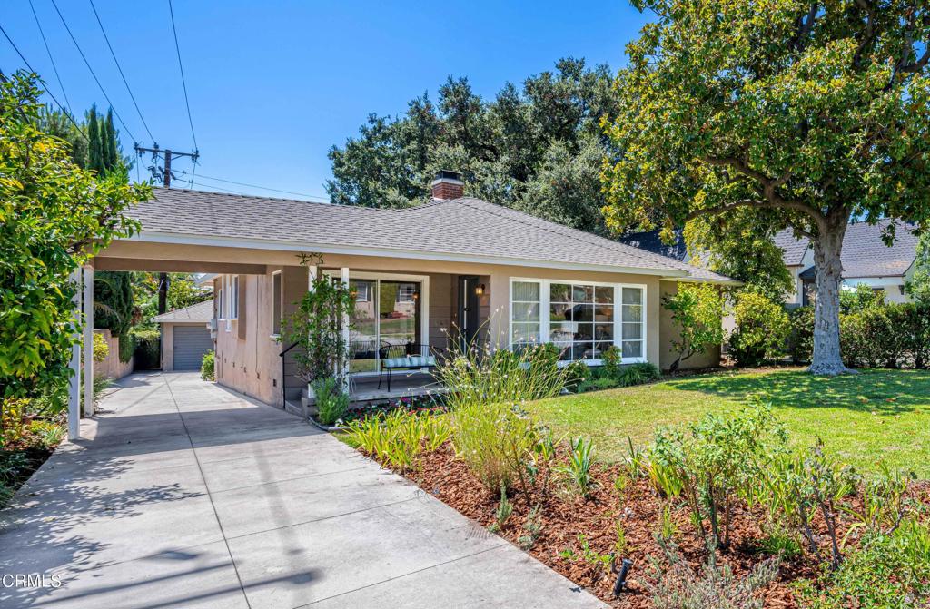 This charming north-facing 1947 Traditional home is located in a pride-of-ownership neighborhood offering stunning mountain views. The property features 3 bedrooms, 1.5 updated bathrooms, an office/sunroom, and beautiful hardwood floors throughout. Highlights include a living room with a double-sided fireplace and a wall of windows framing the mountain scenery. The formal dining room also enjoys mountain views and opens to a modern kitchen with a cozy breakfast nook and an adjacent laundry room with rear access. One of the bedrooms shares the other side of the fireplace and connects to an office space/sunroom with backyard access. The spacious backyard is perfect for outdoor gatherings, featuring a BBQ area with a sink, multiple fruit trees, ample shade, and a spacious double-car garage with an adjacent room ideal for use as an office, gym, or workshop. The home is conveniently located near Eaton Canyon hiking trails, the neighborhood's popular Prime Pizza place, Altadena Country Club, and East Washington Village, which offers wonderful shopping and dining options.