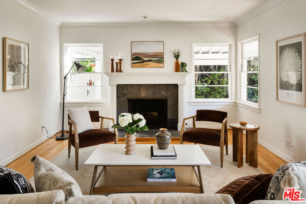 Welcome to this enchanting one-level home nestled in the coveted Chandler Estates neighborhood of Sherman Oaks. Spanning 2,159 square feet on a sprawling 8,646 square foot lot, this circa 1940 home embodies the timeless charm of California living. Step inside to discover a meticulously maintained home brimming with charm and character. Rich hardwood floors and a classic fireplace (decorative, no credits shall be given) anchor the inviting living room, while a generous dining area and cozy den provides an additional space for relaxation or entertainment. The expansive primary suite offers a private retreat, and two additional bedrooms ensure ample space for family and guests. The property is surrounded by mature English gardens, and a sparkling swimming pool, creating a serene and picturesque outdoor setting. A large brick-paved driveway leads to a two-car garage with a bonus space attached, offering potential for an Accessory Dwelling Unit (ADU). This flexible area is perfect for a guest suite, home office, or creative studio, expanding your living options. First time on the market in 50 years, this home promises privacy and a unique opportunity to own a piece of Sherman Oaks' history. Conveniently located just a short drive from the best local amenities, this residence provides both seclusion and accessibility. Please come to one of our open houses or call for a private showing! **Public record shows 4 bed, 2 bath but property shows as 3 bed, 2 bath with a bonus art studio in the backyard. No Showings until Tuesday, September 3rd.