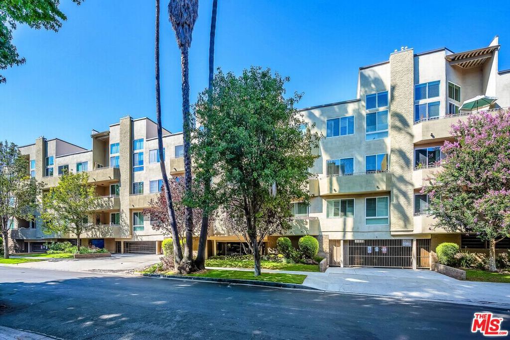 This single-level, 1,600+ sq ft corner unit in the prestigious South of the Boulevard Le Mirabelle condominium complex is just a short stroll to Ventura Blvd in the heart of Sherman Oaks. The 2-bed, 2-bath unit, complete with a den and abundant storage, boasts an aprx 300 ft  private patio with direct access to the pool & spa. Inside, you'll find high ceilings, recessed lighting, and contemporary quartz surfaces throughout. The updated, move-in-ready space includes a full-size, side-by-side washer and dryer, newer windows, fresh paint, and new fixtures. The primary suite features two walk-in closets, while the opposite side of the unit has a second ensuite bedroom. Parking is convenient with side-by-side spaces and a storage unit in the monitored garage. The well-maintained property has good reserves with no special assessments, a liberal pet policy, and the HOA fee includes earthquake insurance. Recent improvements include a new roof and elevators, with additional security and common area projects on the horizon.
