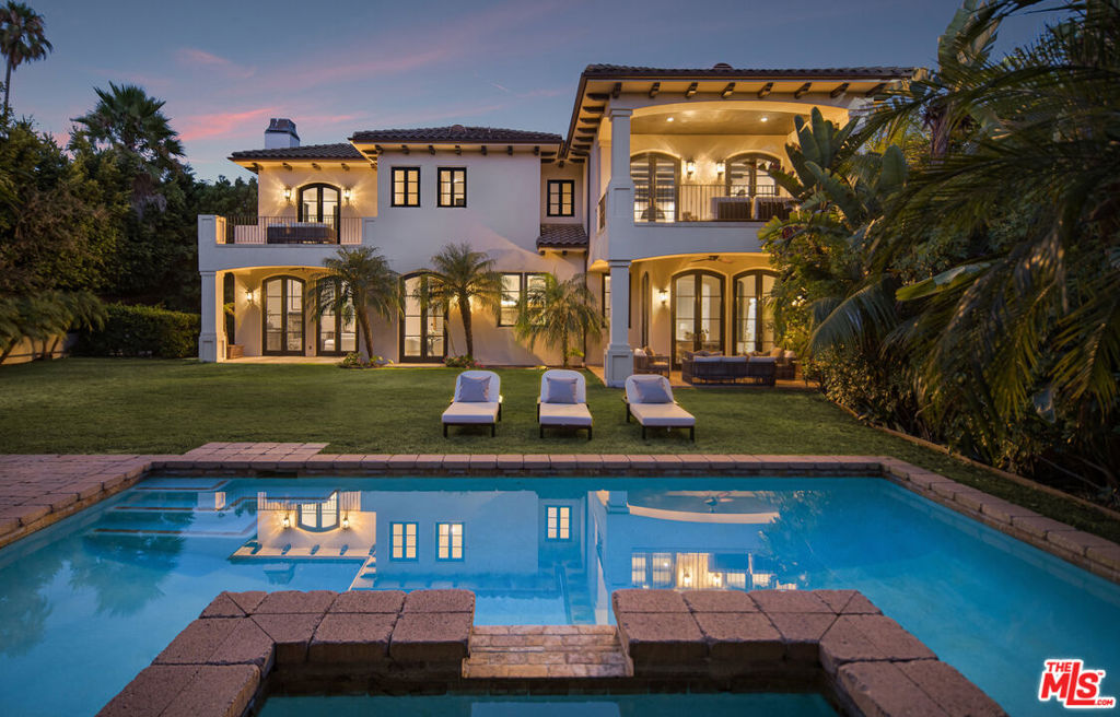 A truly rare opportunity in a prime Beverly Hills location, this luxurious estate is situated just north of Sunset Boulevard, only moments away from the iconic Beverly Hills Hotel. Set on a large, flat lot, this gated and exceptionally private residence boasts breathtaking interiors and a generously expansive layout, featuring 6 bedrooms and 8.5 bathrooms. As you step through the grand two-story entrance, you're welcomed by the elegance of mahogany doors and windows, dark walnut floors, and exquisite detailing that seamlessly flows throughout the home. Stunning arched windows flood the space with natural light, creating a warm and inviting ambiance.The chef's kitchen, a true masterpiece, is equipped with top-of-the-line appliances and opens to a formal family room with a cozy fireplaceperfect for both everyday living and sophisticated entertaining. Upstairs, four ensuite bedrooms provide ample space for family and guests, including the expansive primary suite. This luxurious retreat offers high ceilings, a beautiful stone fireplace, and a large patio that overlooks the tranquil backyard. The primary bathroom is an oasis of luxury, featuring three skylights, dual walk-in closets, dual vanities, dual water closets, an extra-large shower with dual shower heads and a steaming bench, as well as a separate jetted tub.The lower level of the home is dedicated to relaxation and entertainment, featuring a spacious open media room, a gym, a sauna, one bedroom, two full bathrooms, two patios, and abundant storage space. The private backyard is a personal paradise, complete with a sparkling pool and spa, a bathroom with shower, a covered gazebo cabana with a fireplace, and a barbecue/bar area with built-ins. Surrounded by beautifully landscaped gardens and a lush grassy lawn, this outdoor space is ideal for family activities and endless entertaining. This Beverly Hills estate epitomizes luxury living, offering unmatched privacy and elegant design all within close proximity to the very best that Beverly Hills has to offer. LA4- Susanna Leung, HAYLEN.