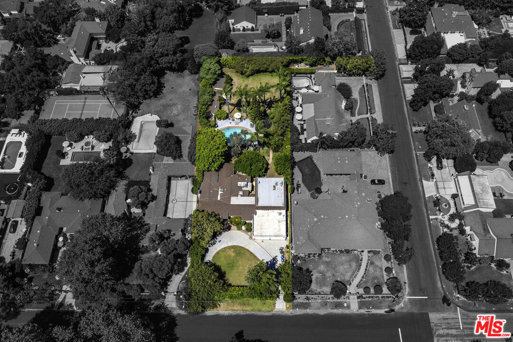 Tremendous opportunity. This property is the original Andy Griffith Estate. The expansive and private almost 3/4-acre flat lot has access from dual driveways, one circular at the front of the property on Ledge Avenue, and a second driveway at the rear with a secluded entrance from Kling Street. The possibilities are endless. Renovate the existing house, build your dream estate, or possibly subdivide and build two grand homes on separate lots. For an individual seeking Complete Privacy, a Huge Lot, and a great location, there is nothing else like it currently available in Toluca Lake for this price.