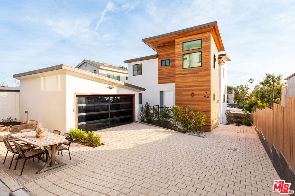 2512 and 2514 Berkeley Ave are the first of their kind in this coveted pocket of Silver Lake. These two contemporary gems highlight the key essentials of turn-key modern architecture with no expense spared. Located on the Eastside, a neighborhood known for its walk ability, amazing restaurants, coffee shops & residential architecture.  From the ground up, everything is brand new and no corners were cut, or expense spared. Wired for smart home capabilities along with surround sound through out and has 3 separate utilities, gas, electric & water. These two residences are identical hosting four bedrooms and four bathrooms, approximately 3,150 sq ft. of living space, and oversized windows throughout with breathtaking views of Downtown Los Angeles. Each level seamlessly connects via steel beam stairway that offers flow between living spaces. Focus has been given to the plethora of natural light that floods both the main and upper levels, enhancing their stunning features. The main floor offers an open floor plan that includes a chef's kitchen complete with custom European cabinetry, Thermador stainless steel appliances, marble counter tops, a large island, a beautiful living room, and a dining area. Off of the main floor is an inviting balcony that plays host to a fantastic chance at entertaining guests. On the upper level is where you will find the primary suite looking out to the city skyline with a gorgeous custom bathroom that includes a soak-in tub and walk-in shower. All bathrooms have European cabinetry with three total bedrooms to complement while one bedroom is accessible on the entry level. 1 of 1 in an area that is mostly coveted for its architectural design. The lower level encompasses a large space, perfect for a theater and game room. This level offers large sliders that open up to give you a seamless indoor-outdoor living space. This fantastic property is just a short walk to Silver Lake Reservoir, Echo Park Lake, LaMill Coffee, Buena Planta, Silver Lake Ramen, Barcari and so much more with Erewon & Whole Foods just a couple minutes' drive away. Priced