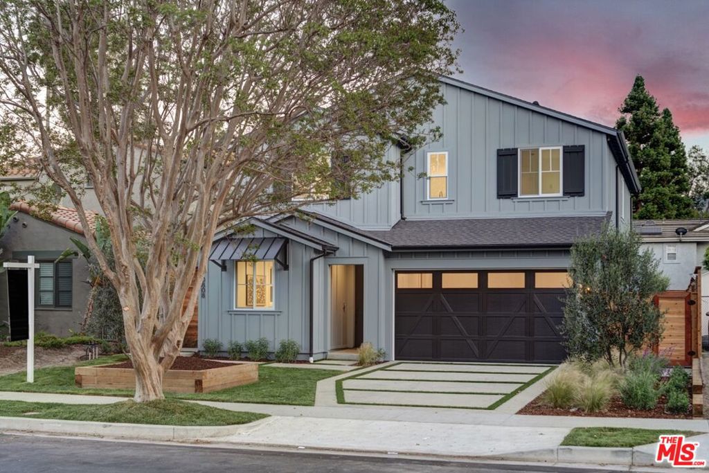 Located in a charming North Hollywood neighborhood near North Weddington Recreation and great restaurants on Lankershim. Stunning, 2-story Farmhouse has an open floor plan and overall spectacular layout that flows graciously. The inviting entry leads the way to the chef-inspired kitchen with top-of-the-line appliances, an island with bar seating, a walk-in pantry, and a sunny breakfast nook. The kitchen is open to the dining and great room with an elegant fireplace. Sliding doors open from the great room to the expansive backyard with room for a pool. The second level has two secondary bedrooms, one of which is ensuite, a laundry room with sink, and a full bath. The luxurious grand suite is spacious and has a gorgeous grand bath with a freestanding tub, walk-in shower, and a walk-in closet. Attached ADU on the ground level has a private entrance, a large living space, kitchenette, and a full bath. New TJH homeowners will receive a complimentary 1-year membership to Inspirato, a leader in luxury travel.
