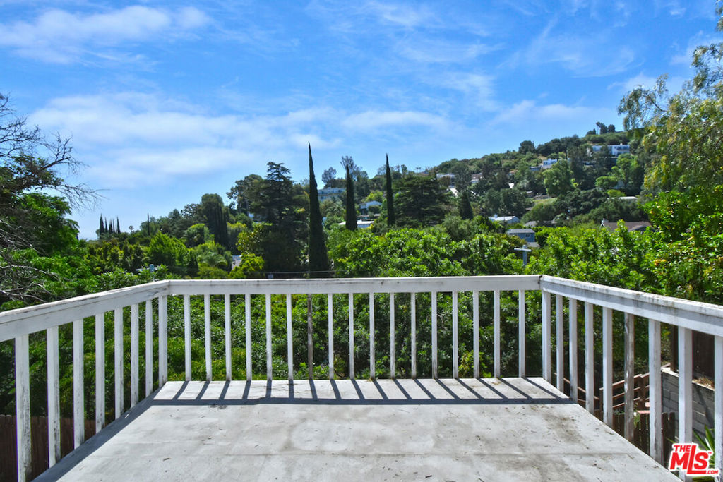 Incredible Fixer-Upper Opportunity: Charming 2-Bedroom, 2-Bathroom Home with Stunning Views, inviting you to bring your vision to life. First time on the market in over 20 years, this remarkable fixer-upper presents a unique chance to own a home with immense potential. Offered in "AS IS" condition.  Located in a highly desirable South of the Boulevard area. The home features a bright and open living room that offers unbelievable views and an extended deck perfect for entertaining or relaxing. The expansive kitchen is ready for your updates, and the massive primary suite includes a walk-in closet and a spacious bathroom capturing the views. Additionally, there is a bonus room that can be converted into a third bedroom. The serene backyard, surrounded by lush greenery, provides a calming retreat. Centrally located, you'll enjoy easy access to Ventura Boulevard, Glen Centre, Century City, UCLA, and major freeways, making this home as convenient as it is charming. Offers are due by 5 PM on September 16, 2024-don't miss this exceptional opportunity to create your dream home.