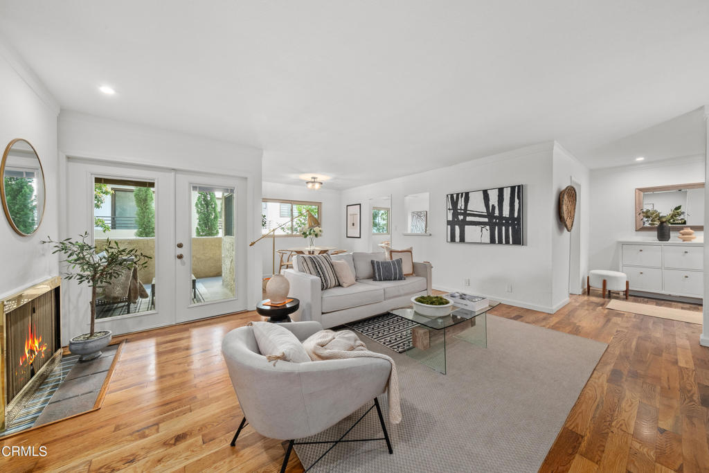 This Freshly Updated, End Unit condo, is tucked back into a quiet, off-street location in the complex and includes a dining-sized patio plus easy access to the pool, BBQ area and the 2 car gated parking, while being just a few blocks north of San Marino. With its 1,092 SQ FT, it has only 1 common wall and nobody below, providing privacy not commonly found in many condos. Enter through a large home-like entry hall with included shoe cabinetry, and then proceed into the open plan living/dining area, which has a modern, fresh sense to it, with decorative fireplace, updated windows, refinished wood floors, and flows directly out to the patio through double pane, integrated blind, French doors. The bright, remodeled eat-in kitchen has generous quartz counter space, hardwood floors, 4-burner electric stove/oven, built-in microwave, stainless refrigerator, and generous cabinet space. The center hall leads to the 2 spacious bedrooms and an updated, luxuriously sized guest bath with tub. The Main Suite sits privately away from the rest of the unit and has its own 3/4 updated bathroom and large, galley style closet with built in cabinet.  Central air, forced air heat, new electrical panel, recessed lighting, dual paned windows and new paint throughout, and new laminate floors in the bedroom wing, complete the move-in ready condition of this condo. A special feature of this unit is that there are no stairs from the unit to either the pool or the dedicated 2 gated parking spaces, which is rare for most buildings in Pasadena. The complex features a large, sunlit center courtyard pool, 2nd floor activity room with billiards table, an updated gym with private shower, BBQ area with seating for many, 2 large community laundry rooms, earthquake insurance and gated subterranean parking, with dedicated guest parking as well. It is set very conveniently close to many amenities: a Vons with Starbucks, Walgreens, and a wide variety of notable restaurants are within a 1/2 mile, while The Metro Rail Allen station, Target, Home Depot and the 210 freeway on ramps are all within a 1 1/2 miles. An incredible location within Pasadena, this updated, modern, private and quiet off-street end unit is ready to move-in and have its new chapter of ownership begin!