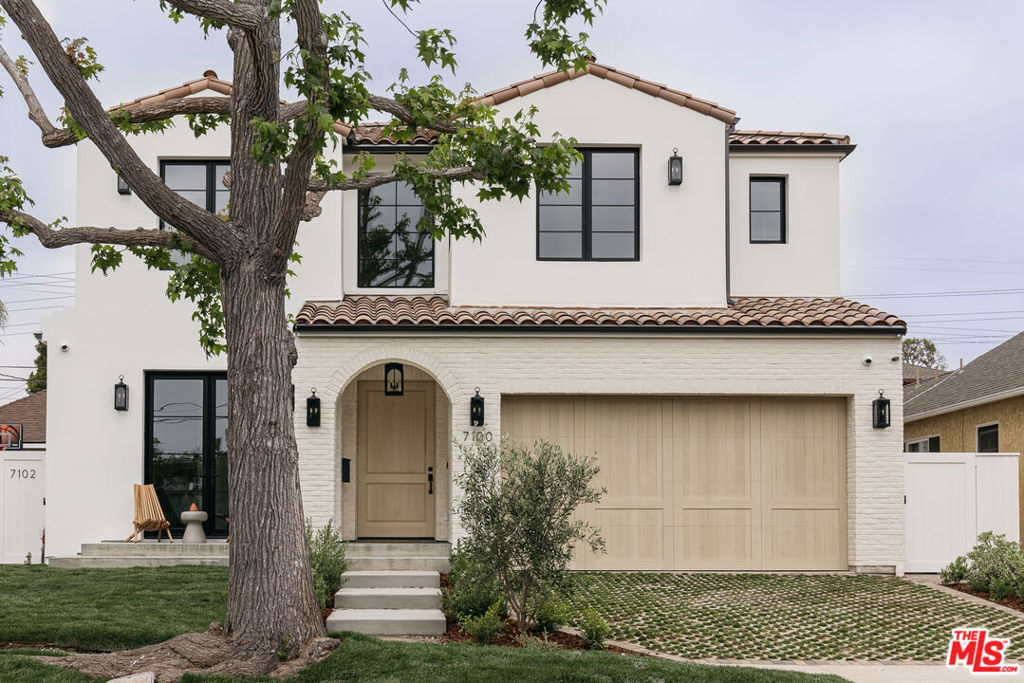 This Pinterest-worthy, custom designed Modern Spanish pool home is located deep in North Kentwood on an ideal, quiet, tree-lined street. Featuring 5 bedrooms and 4.5 bathrooms in the main house, plus a detached 1 bedroom, 1 bath ADU, this special property offers plenty of space for modern living, in a design-focused and quality-built home.  The efficient, open concept floor plan boasts an oversized great room with high ceilings, abundant natural light, and a cozy plaster fireplace, creating an ideal setting for family gatherings and entertaining.  The chef's kitchen is a culinary dream, featuring two full-size sinks and dishwashers, Thermador appliances, an Italian double range, plaster hood, honed marble countertops with Azerocare protective treatment, custom cabinetry, a large center island, a walk-in pantry with an arched Pinky's iron door, and a bifold window with pass-through bar. Enjoy meals in the adjacent dining area or out on the cozy patio with its own outdoor fireplace and a built-in BBQ.  The first floor also features an en-suite bedroom/office, a beautiful powder room with marble sink imported from Turkey, a mudbench "drop zone", and a two-car garage with epoxied floors and a walk-in storage/media closet.  Up the beautiful, light-filled staircase, find a Primary Suite, three additional bedrooms and two bathrooms, and a large laundry room. The luxurious Primary Suite offers a serene retreat with roman clay walls, vaulted ceilings, multi-slide doors leading out to a balcony, a large custom walk-in closet, automatic window shades, and an en-suite bathroom complete with dual vanities, a soaking tub, a gorgeous glass-enclosed shower, and a water closet. Three generously sized bedrooms all with vaulted ceilings provide ample space for family, guests, or a home office.  One bedroom has its own en-suite bathroom with oversized shower, and two bedrooms share a large bathroom with double sinks, a linen tower, and a shower/tub.  Step outside to your private backyard paradise, complete with a cozy patio, lush landscaping, and a heated pool and spa with automatic cover.  This home is equipped with a smart home system including indoor and outdoor speakers, hard-wired security cameras, Cat6 wiring, and a mesh wifi system.  In addition, it features energy-efficient Lincoln clad doors and windows, two tankless water heaters, wide plank oak floors, dual zoned AC, smart thermostats, solid core doors with Emtek hardware, and countless other top-of-the-line features.  The detached guest house (ADU) features a living room with stylish kitchen, separate bedroom and bathroom (with pool access), and a walk-in closet with laundry hookups.  Located in an A+ location within a highly sought-after family neighborhood, you'll enjoy close proximity to local amenities and all that Silicon Beach has to offer. Don't let this one-of-a-kind home pass you by!